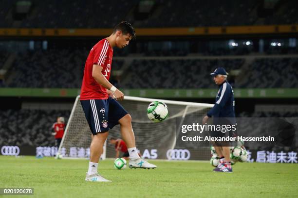 James Rodriguez of FC Bayern Muenchen plays with the ball during a training session at Shenzhen Universiade Sports Centre during the Audi Summer Tour...