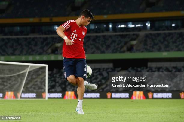 James Rodriguez of FC Bayern Muenchen plays with the ball during a training session at Shenzhen Universiade Sports Centre during the Audi Summer Tour...