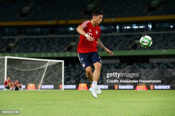 James Rodriguez of FC Bayern Muenchen plays with the ball during a training session at Shenzhen Universiade Sports Centre during the Audi Summer Tour...