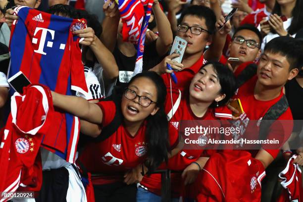 Supporters of FC Bayern Muenchen during a training session at Shenzhen Universiade Sports Centre during the Audi Summer Tour 2017 on July 21, 2017 in...