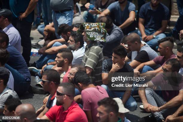 Palestinian worshippers are seen during a pray in Ras el-Amud Area outside the Old City on July 21, 2017 in Jerusalem, Israel. Following last Friday...