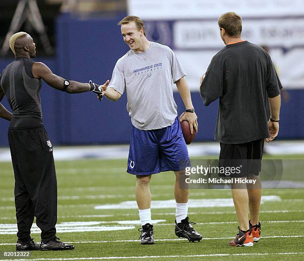 Colts quarterback Peyton Manning greets Chad Johnson and Carson Palmer during pregame at the RCA Dome in Indianapolis, Indiana on September 1, 2006....