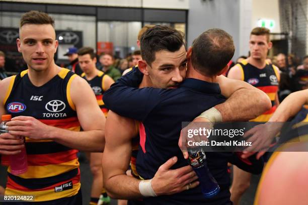 Adelaide Crows Senior Coach Don Pyke congratulates Taylor Walker of the Crows after the round 18 AFL match between the Adelaide Crows and the Geelong...