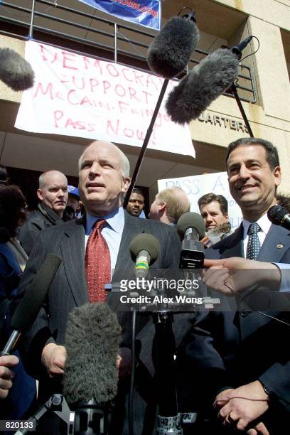 Sen. John McCain , left, and Sen. Russ Feingold hold a press conference outside the Democratic National Committee March 19, 2001 in Washington, DC....