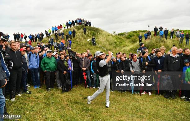 Dustin Johnson of the United States plays from the rough on the 8th hole during the second round of the 146th Open Championship at Royal Birkdale on...