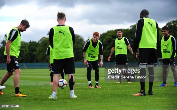 Jack Colback laughs as he is in the middle of the boxes game during the Newcastle United Training session at Carton House on July 21 in Maynooth,...