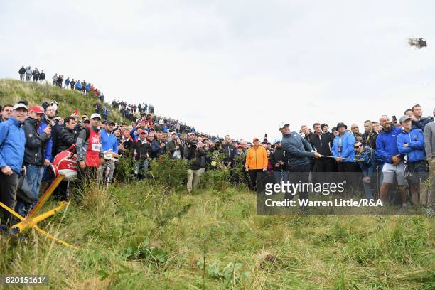 Rory McIlroy of Northern Ireland plays out of the rough on the 15th hole during the second round of the 146th Open Championship at Royal Birkdale on...