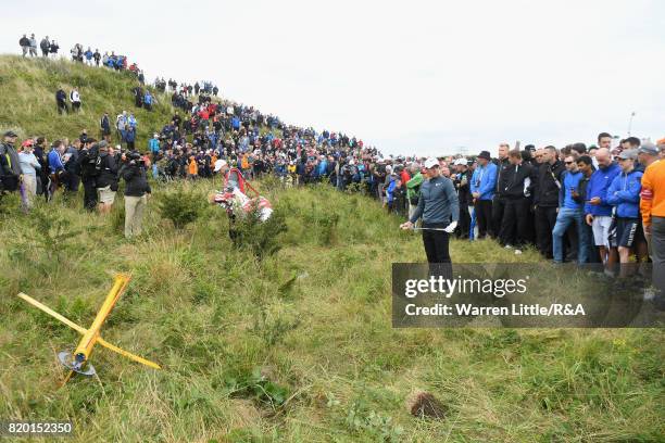 Rory McIlroy of Northern Ireland prepares to play out of the rough on the 15th hole during the second round of the 146th Open Championship at Royal...