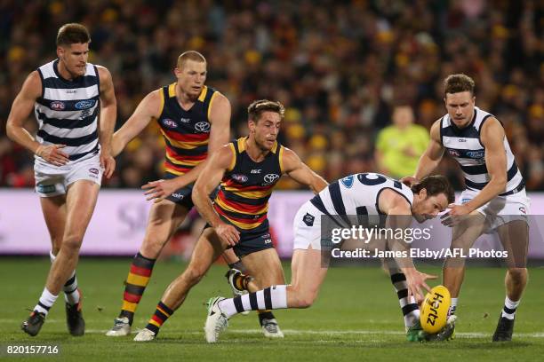 Richard Douglas of the Crows tackles Patrick Dangerfield of the Cats during the 2017 AFL round 18 match between the Adelaide Crows and the Geelong...