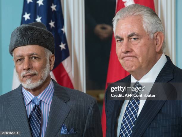 Secretary of State Rex Tillerson answers a question from the media standing with the Foreign Minister of Oman, Yusuf bin Alawi-bin Abdullah, inside...