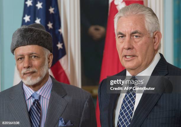 Secretary of State Rex Tillerson answers a question from the media standing with the Foreign Minister of Oman, Yusuf bin Alawi-bin Abdullah, inside...