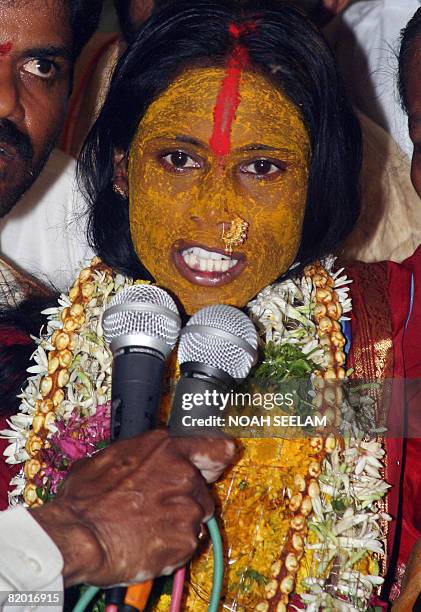 Indian Hindu religious woman SwarnaLatha, who undertook a vow of chasity and devoted her life to the Hindu goddess Mahankali, answers questions in a...