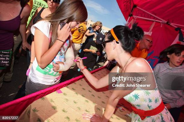 Katy Perry signs autographs at the Van's Warped Tour at Seaside Park on June 22, 2008 in Ventura, California.