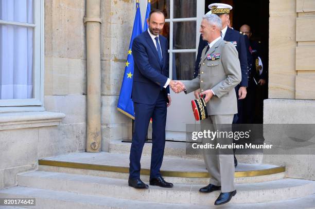 Army Commander in Chief General Francois Lecointre and French Prime Minister Edouard Philippe shake hand after a meeting at Hotel Matignon on July...