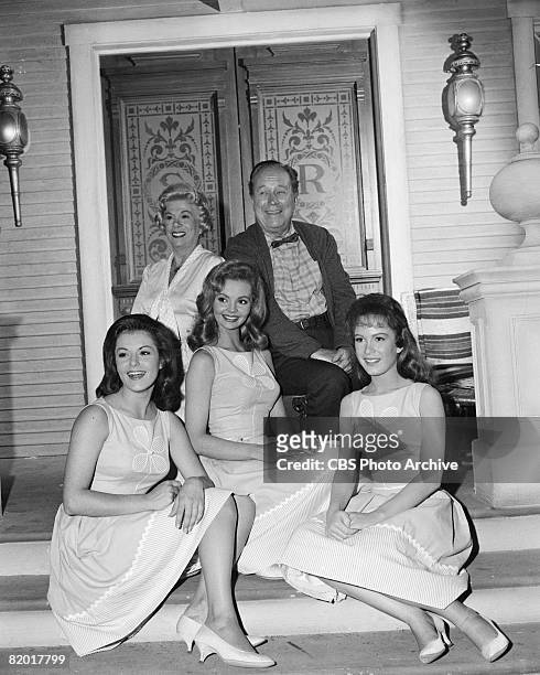 American actors Bea Benaderet , as Kate Bradley, and Edgar Buchanan , as Joseph P. 'Uncle Joe' Carson, pose with American actresses, front row from...