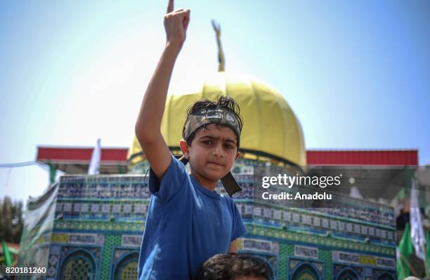 Palestinian child gestures during protest rally organized by the Hamas, Islamic Jihad Movement, Palestine Liberation Organization and Democratic...