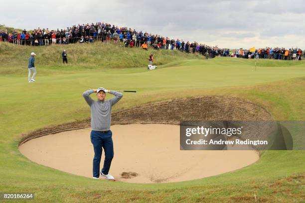 Ian Poulter of England gestures after his third shot from a bunker on the 8th hole during the second round of the 146th Open Championship at Royal...