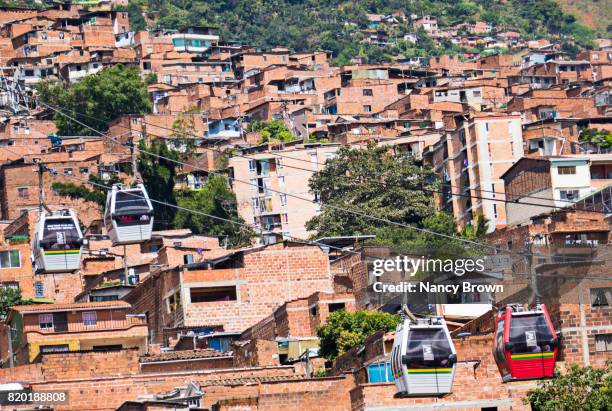 metro cable cars in medellin colombia that run from the mountains to the city - metro medellin stock pictures, royalty-free photos & images