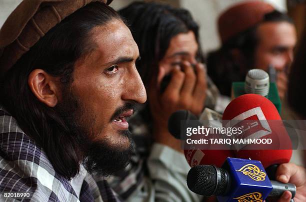 Leader of Tehreek-e-Taliban Pakistan , Maulvi Khalid Omer addresses the media representatives at a tribal district of Mohmand Agency on July 21,...