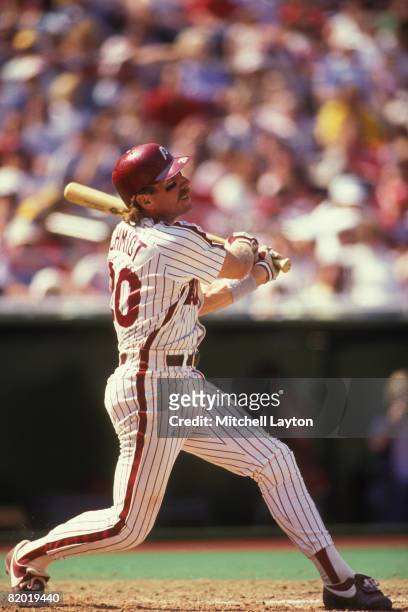 Mike Schmidt of the Philadelphia Phillies bats during a baseball game against the Cincinnati Reds on April 30, 1989 at Veterans Stadium in...