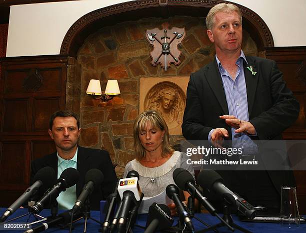 Spokesman Clarence Mitchell addresses the media beside Kate and Gerry McCann as they start a press conference to anounce that they have been cleared...