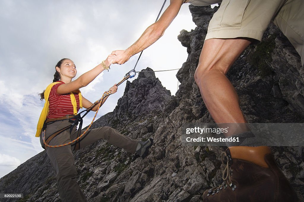 Austria, Salzburger Land, couple mountain climbing