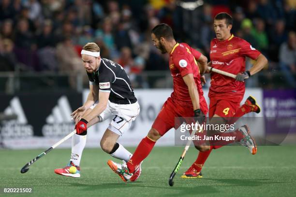 Christopher Ruhr of Germany attempts to get past Ricardo Santana of Spain during the semi-final match between Spain and Germany on Day 7 of the FIH...