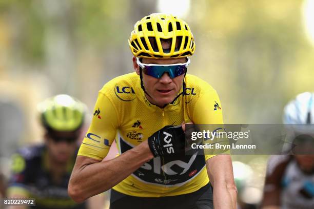 Christopher Froome of Great Britain riding for Team Sky wearing the yellow leaders jersey crosses the finish line on stage nineteen of the 2017 Tour...