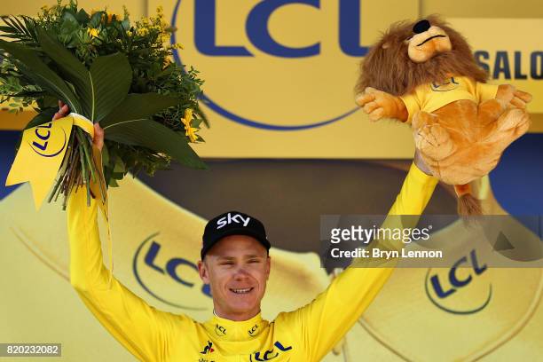 Christopher Froome of Great Britain riding for Team Sky is presented with the yellow jersey on the podium after stage nineteen of the 2017 Tour de...
