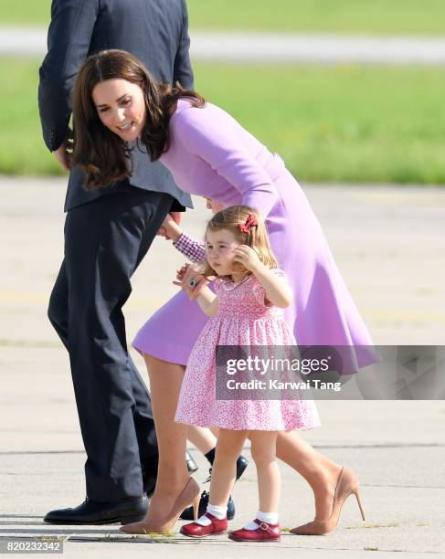 Princess Charlotte of Cambridge and Catherine, Duchess of Cambridge view helicopter models H145 and H135 before departing from Hamburg airport on the...