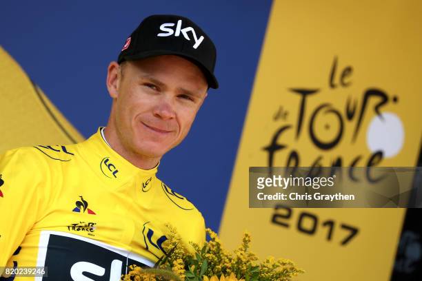 Christopher Froome of Great Britain riding for Team Sky in the leader's jersey poses for a photo on the podium following stage 19 of the 2017 Le Tour...