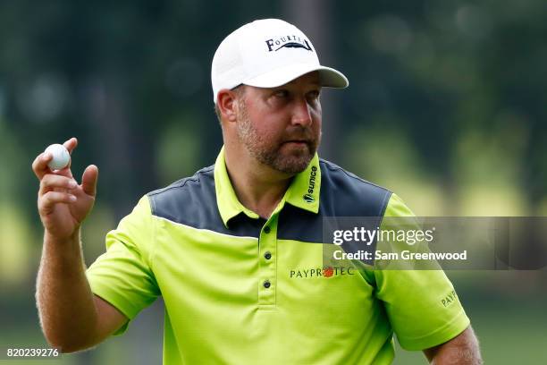 Chad Collins of the United States reacts to his birdie on the 15th green during the second round of the Barbasol Championship at the Robert Trent...