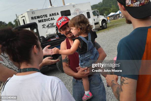 People leave after receiving free healthcare services at the Remote Area Medical mobile clinic on July 21, 2017 in Wise, Virginia. RAM holds the...