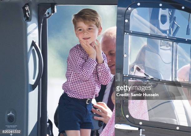 Prince George of Cambridge views helicopter models H145 and H135 before departing from Hamburg airport on the last day of their official visit to...