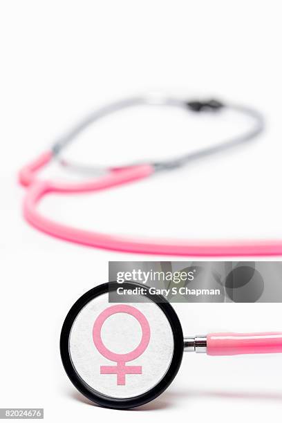 pink stethoscope with female symbol - female symbol stock pictures, royalty-free photos & images