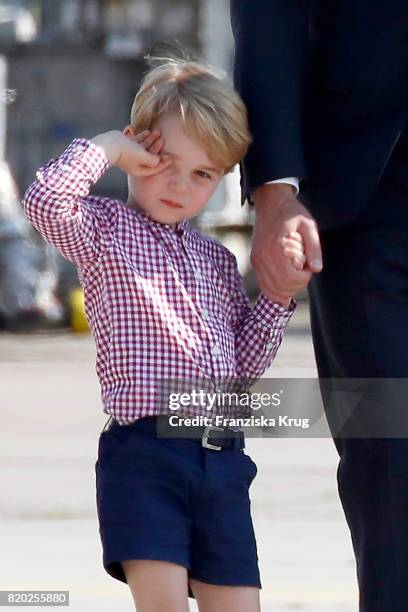 Prince George of Cambridge views helicopter models H145 and H135 before departing from Hamburg airport on the last day of their official visit to...