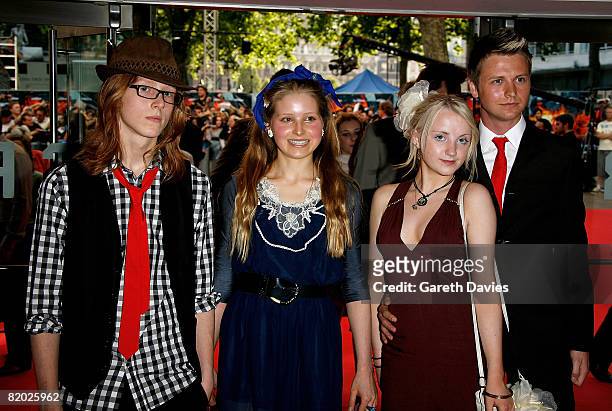 Actresses Evanna Lynch and Jessie Cave and their guests arrive at the European film premiere of 'The Dark Knight' at the Odeon Leicester Square on...
