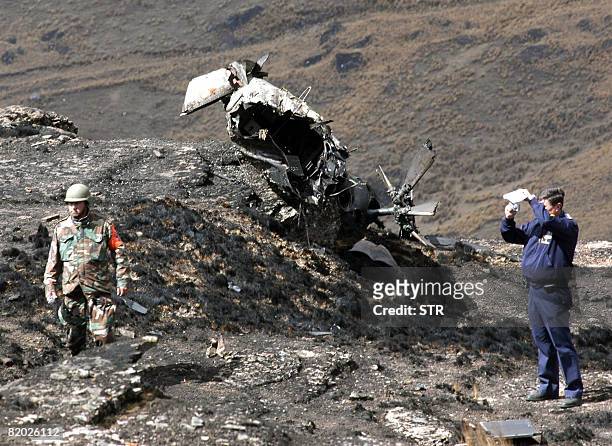 Bolivian Air Force officials inspect on July 21, 2008 the site where a Venezuelan Super Puma helicopter crashed yesterday in Colomi, in the...