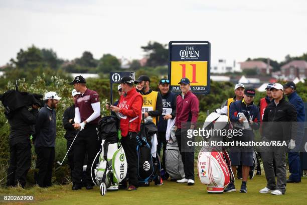 The Louis Oosthuizen of South Africa and Jordan Spieth of the United States groups wait on the 11th tee during the second round of the 146th Open...