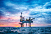 HDR of Offshore Jack Up Rig in The Middle of The Sea at Sunset Time