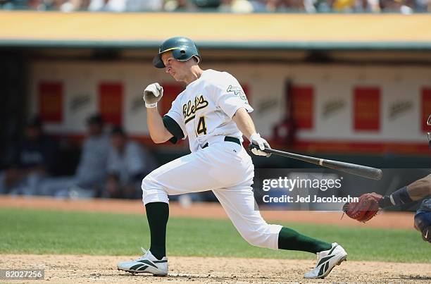 Mark Ellis of the Oakland Athletics swings at the pitch against the Seattle Mariners during a Major League Baseball game on July 10, 2008 at McAfee...