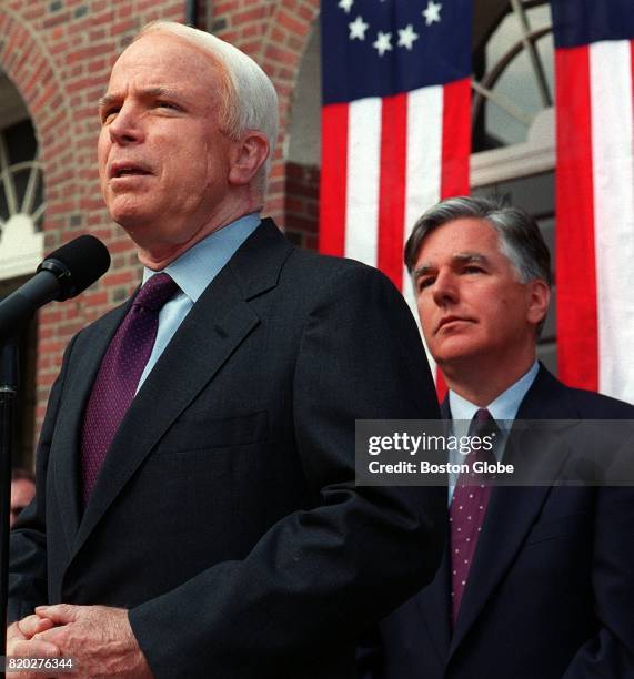 Sen. John McCain, left, speaks during a campaign reform rally outside Faneuil Hall in Boston on Jul. 9, 2001. Rep. Marty Meehan stands at right.