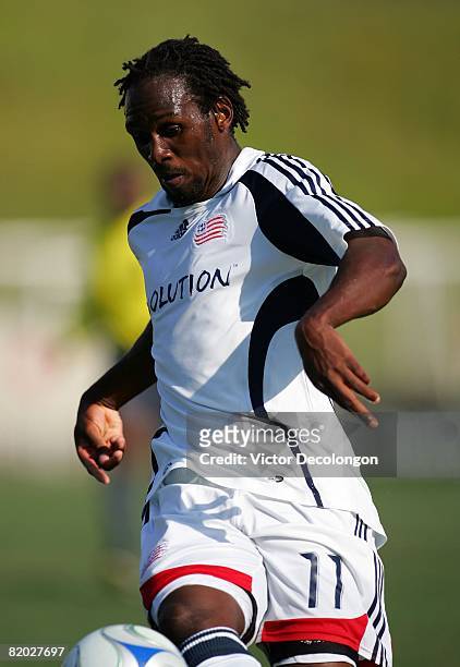 Kheli Dube of the New England Revolution looks to control the ball on the attack in the first half during SuperLiga match play against CD Chivas USA...