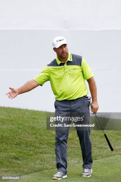 Chad Collins of the United States reacts as he misses his putt for birdie and 59 under for the round on the 18th green during the second round of the...