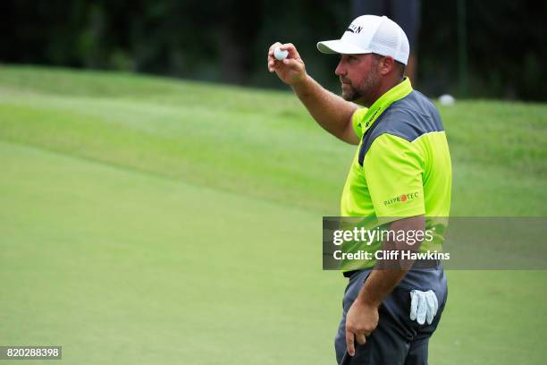 Chad Collins of the United States reacts after finishing on the 18th green during the second round of the Barbasol Championship at the Robert Trent...