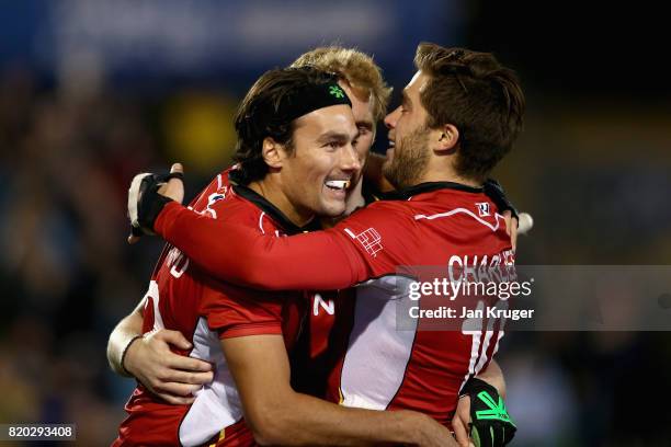 Simon Gougnard of Belgium celebrates scoring his sides second goal with his team mates during the semi-final match between Australia and Belgium on...