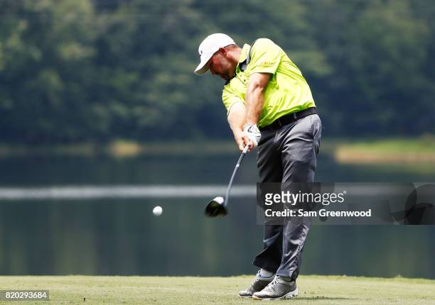 Chad Collins of the United States plays his shot from the 18th tee during the second round of the Barbasol Championship at the Robert Trent Jones...