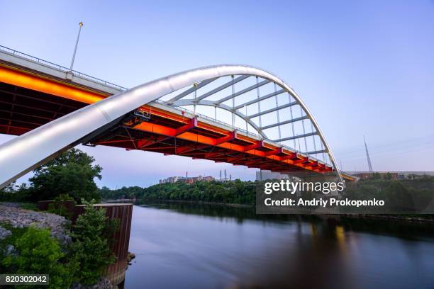 low angle view of gateway boulevard bridge in nashville at dusk, tennessee, usa - nashville night stock pictures, royalty-free photos & images