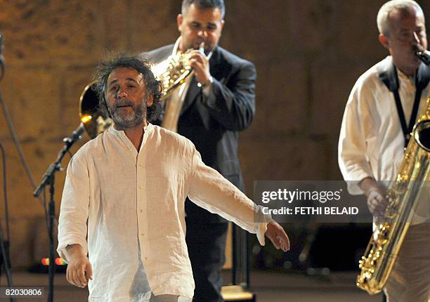 Italian maestro Mario Tronco of the Orchestra Di Piazza Vittorio performs during the 44th edition of the Carthage International Festival, on July 21,...