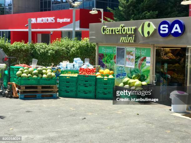 carrefour express market in balmumcu district - carrefour market stock pictures, royalty-free photos & images